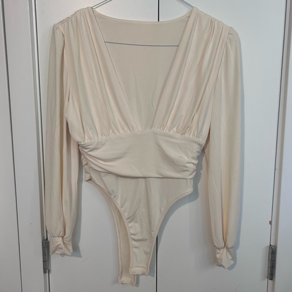 Fashion Nova Tops - BNWOT cream long sleeve bodysuit